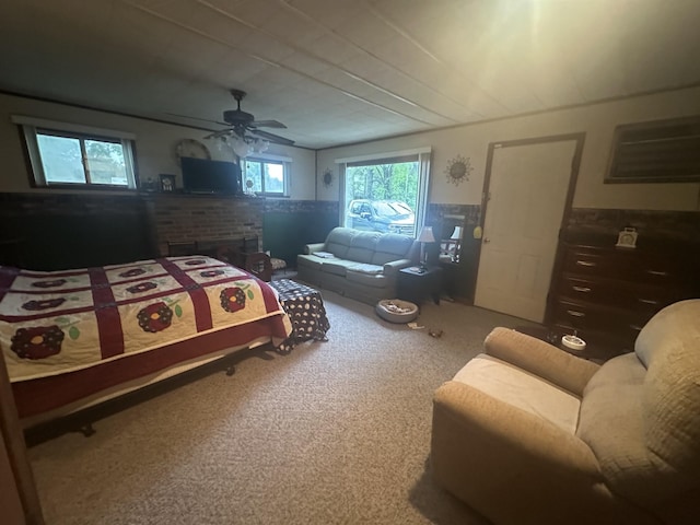 carpeted bedroom featuring a wainscoted wall and ceiling fan