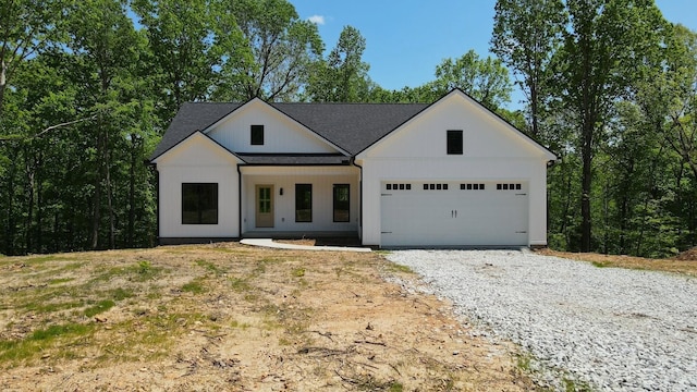 2775 Mayne Trace Rd, Waverly, TN 37185 - modern farmhouse style home with an attached garage and gravel driveway