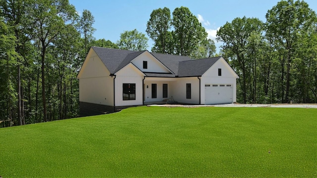 2775 Mayne Trace Rd, Waverly, TN 37185 - modern farmhouse with an attached garage, driveway, and a front yard