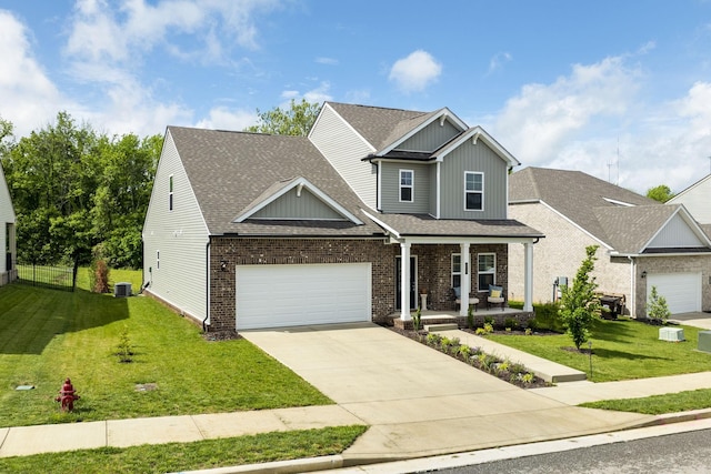 2137 Creekland View Blvd, Nashville, TN 37207 - craftsman inspired home with covered porch, driveway, an attached garage, and brick siding