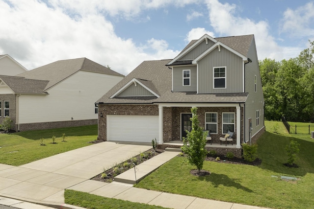 2137 Creekland View Blvd, Nashville, TN 37207 - craftsman-style home featuring covered porch, board and batten siding, an attached garage, driveway, and a front lawn