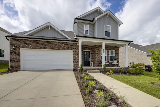 2137 Creekland View Blvd, Nashville, TN 37207 - craftsman house with covered porch, board and batten siding, brick siding, driveway, and a front lawn