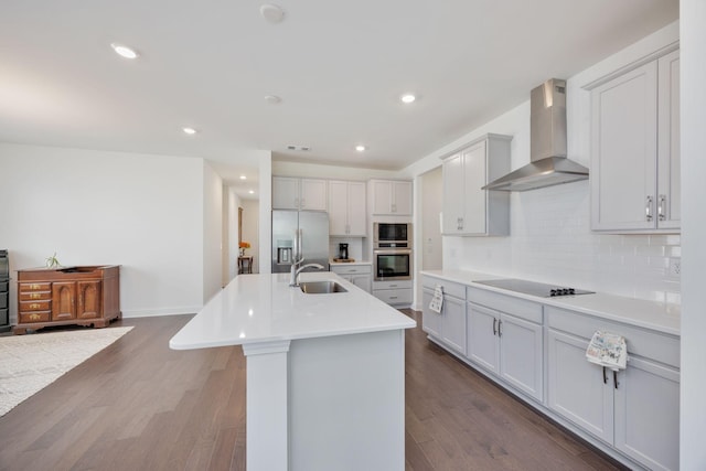 2137 Creekland View Blvd, Nashville, TN 37207 - kitchen with wall chimney range hood, stainless steel fridge, black electric stovetop, a sink, and backsplash