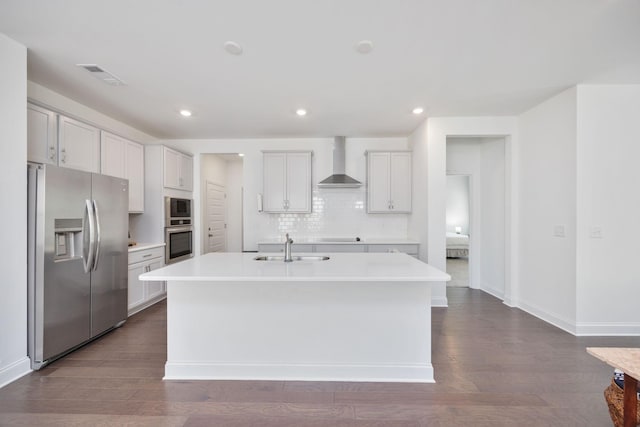 2137 Creekland View Blvd, Nashville, TN 37207 - kitchen with appliances with stainless steel finishes, wall chimney exhaust hood, a sink, a center island with sink, and tasteful backsplash