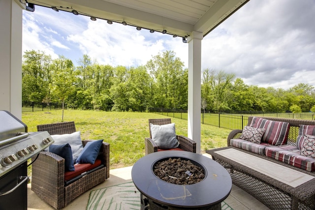 2137 Creekland View Blvd, Nashville, TN 37207 - view of patio with grilling area, view of wooded area, and an outdoor living space with a fire pit