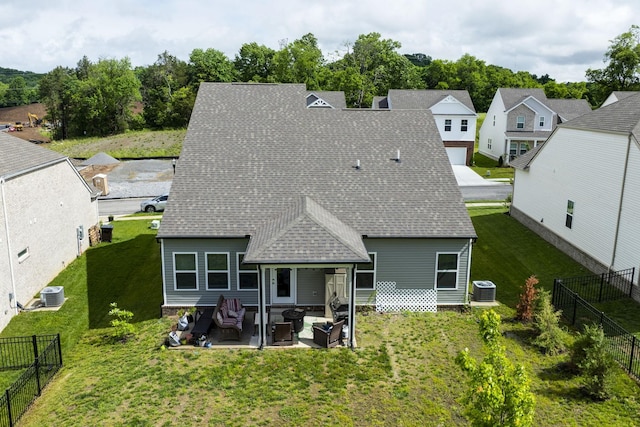 2137 Creekland View Blvd, Nashville, TN 37207 - back of property with an outdoor hangout area, roof with shingles, a patio area, and central AC