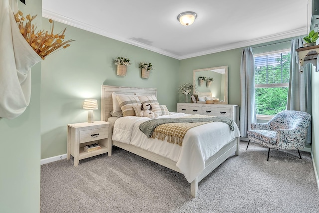 carpeted bedroom with baseboards and ornamental molding