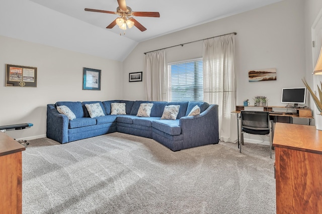 living area with a ceiling fan, lofted ceiling, carpet floors, and baseboards