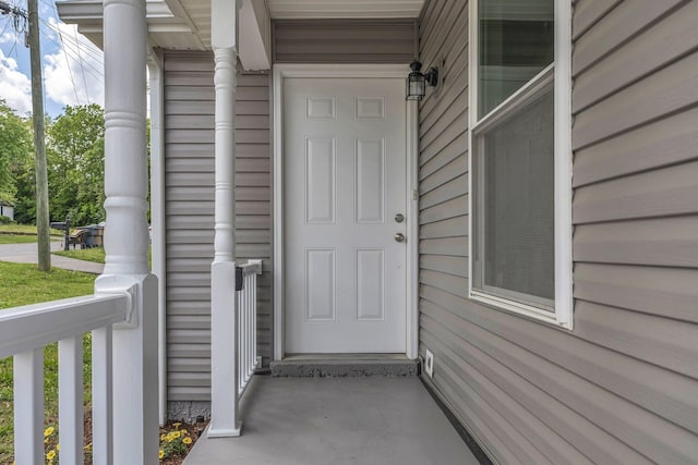 entrance to property with covered porch