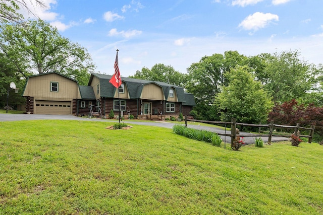 209 Green Valley Blvd, Franklin, TN 37064 - view of front of home featuring driveway, roof with shingles, a front yard, log siding, and a gambrel roof
