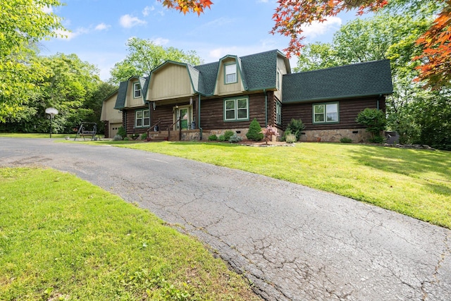 209 Green Valley Blvd, Franklin, TN 37064 - log-style house featuring a gambrel roof, a front lawn, roof with shingles, and log exterior