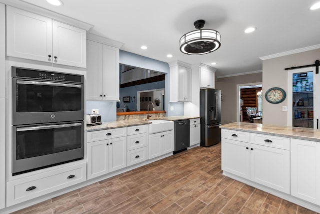 209 Green Valley Blvd, Franklin, TN 37064 - kitchen featuring stainless steel double oven, a sink, fridge with ice dispenser, ornamental molding, and black dishwasher