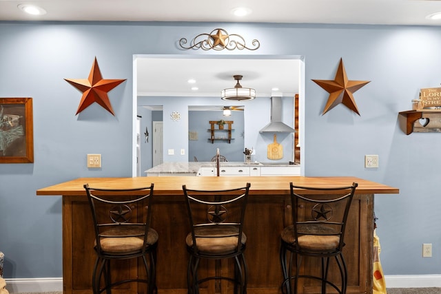 209 Green Valley Blvd, Franklin, TN 37064 - bar with recessed lighting, a sink, baseboards, and wall chimney range hood