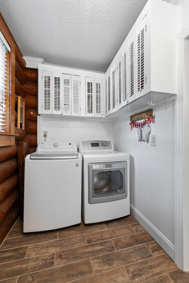 209 Green Valley Blvd, Franklin, TN 37064 - clothes washing area with laundry area, a textured ceiling, rustic walls, separate washer and dryer, and dark wood-type flooring