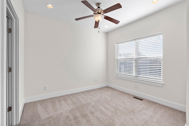 empty room featuring recessed lighting, carpet, ceiling fan, baseboards, and visible vents