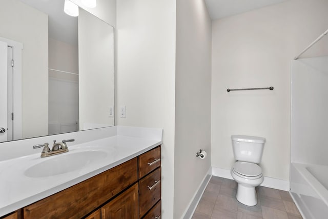 full bathroom featuring vanity, toilet, and baseboards