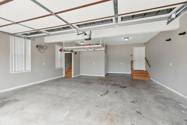 garage featuring baseboards and a garage door opener