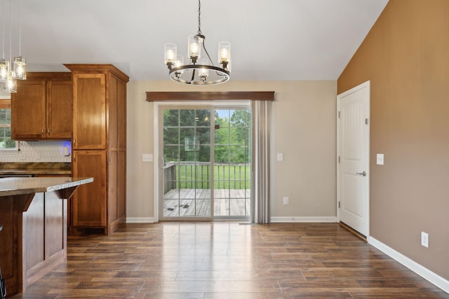 kitchen featuring decorative light fixtures, a chandelier, dark wood-style floors, and brown cabinetry