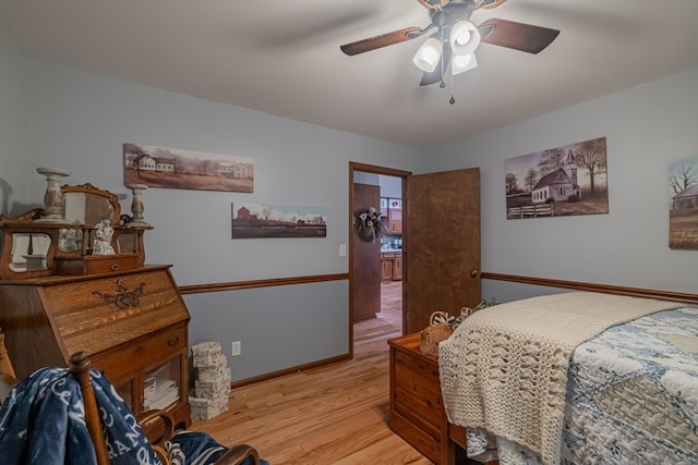 bedroom with baseboards, a ceiling fan, and light wood finished floors