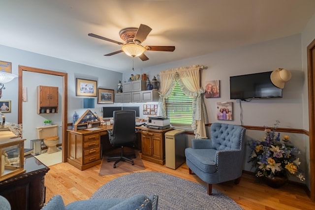 office area featuring light wood-type flooring and a ceiling fan