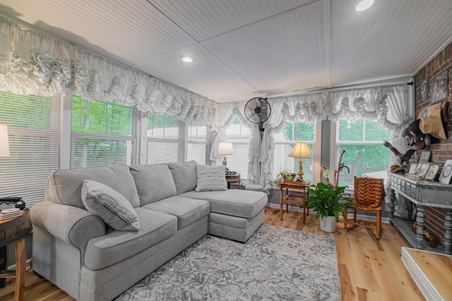 sunroom / solarium featuring wood finished floors, recessed lighting, and wooden ceiling