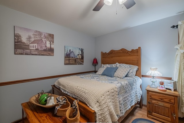 bedroom with wood finished floors and ceiling fan