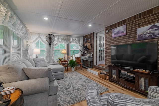 living room featuring recessed lighting, wood finished floors, brick wall, and wood ceiling