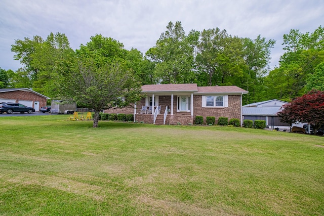 ranch-style home with a front yard, covered porch, and brick siding
