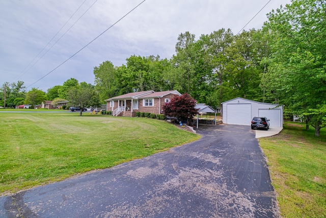 view of front of property featuring an outdoor structure, a front lawn, a garage, and a porch