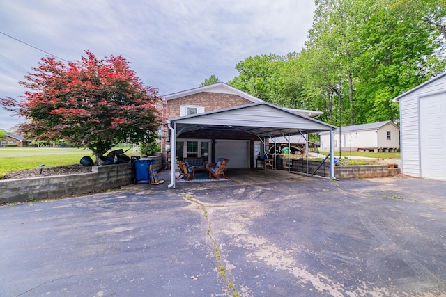exterior space featuring an outbuilding and a garage