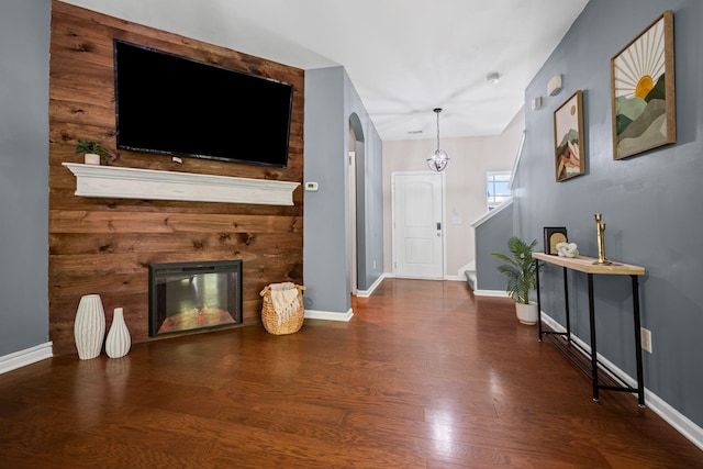 208 Wyburn Pl, Burns, TN 37029 - living area featuring baseboards, a fireplace, and wood finished floors