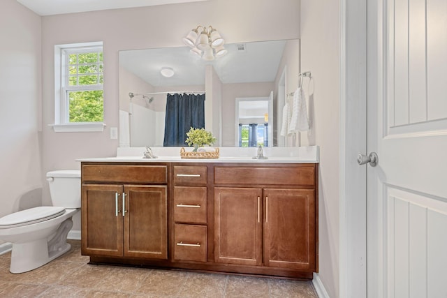 208 Wyburn Pl, Burns, TN 37029 - full bath with double vanity, toilet, a shower with curtain, and a sink