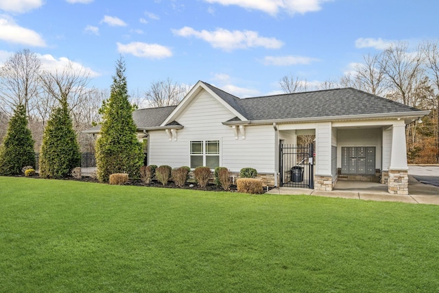 208 Wyburn Pl, Burns, TN 37029 - back of house with a yard, stone siding, and roof with shingles