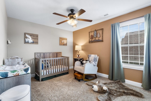 bedroom featuring baseboards, ceiling fan, carpet flooring, and visible vents