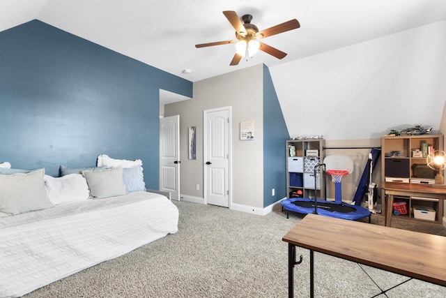 bedroom with baseboards, a ceiling fan, vaulted ceiling, and carpet flooring