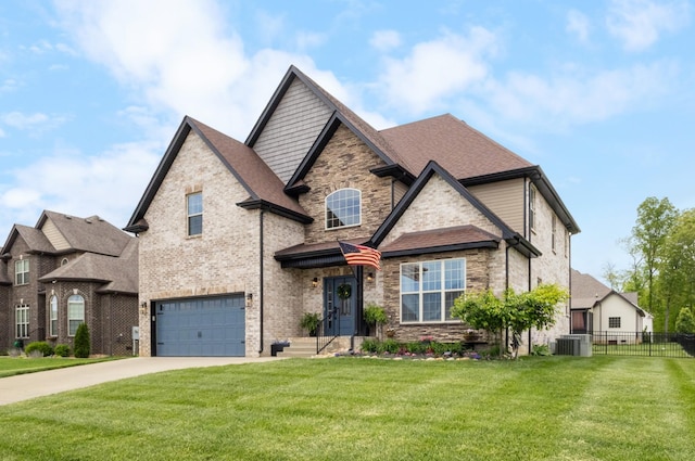 craftsman inspired home with fence, an attached garage, driveway, and stone siding