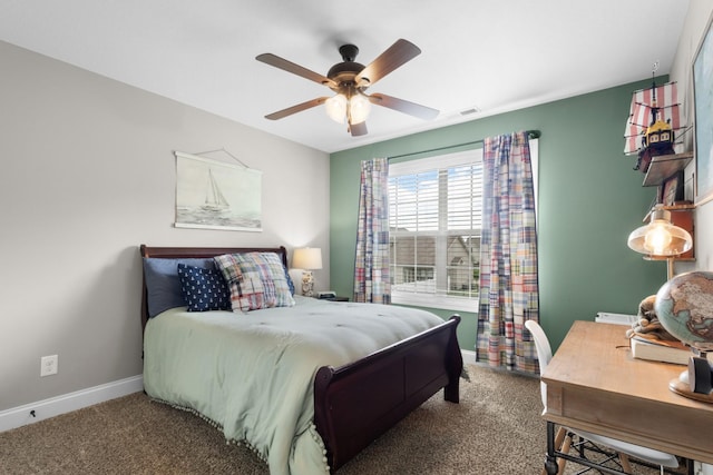 carpeted bedroom with baseboards and ceiling fan