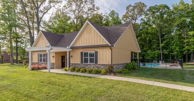 craftsman inspired home featuring roof with shingles, a pergola, and stone siding
