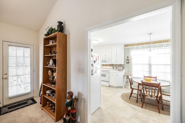 entryway with a healthy amount of sunlight and lofted ceiling