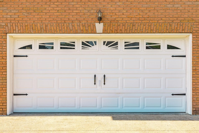 garage with concrete driveway