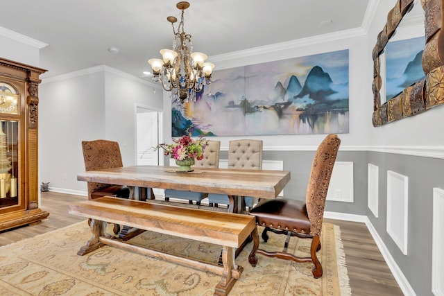 1072 Sumner Grv, Spring Hill, TN 37174 - dining area with baseboards, an inviting chandelier, ornamental molding, and wood finished floors