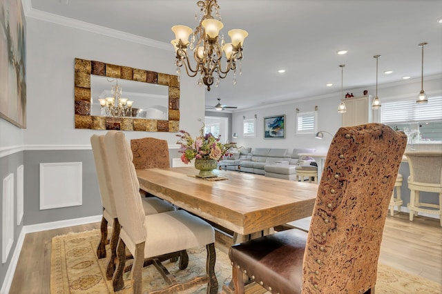 1072 Sumner Grv, Spring Hill, TN 37174 - dining space featuring crown molding, ceiling fan with notable chandelier, wood finished floors, and a wealth of natural light