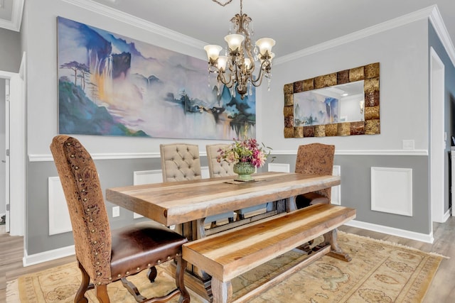 1072 Sumner Grv, Spring Hill, TN 37174 - dining room with baseboards, a notable chandelier, ornamental molding, and light wood finished floors