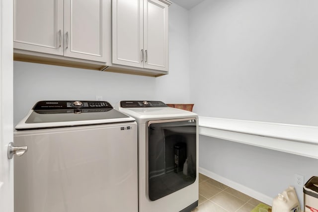 1072 Sumner Grv, Spring Hill, TN 37174 - clothes washing area featuring independent washer and dryer, light tile patterned flooring, baseboards, and cabinet space
