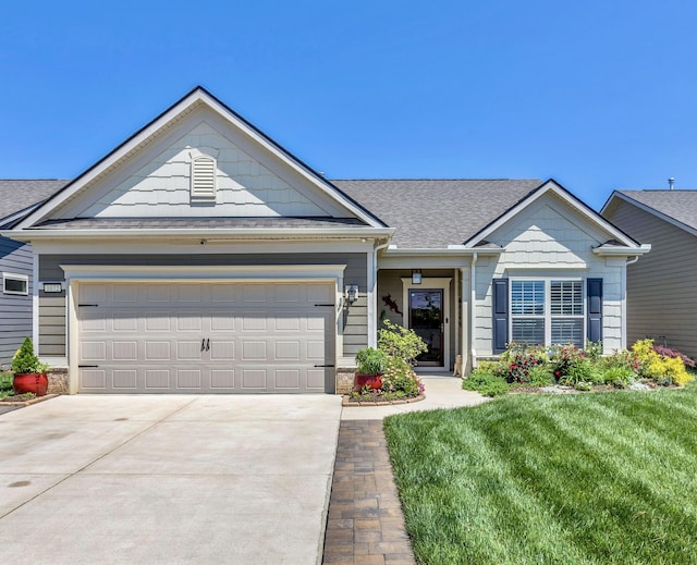 1072 Sumner Grv, Spring Hill, TN 37174 - ranch-style home with an attached garage, roof with shingles, driveway, and a front yard