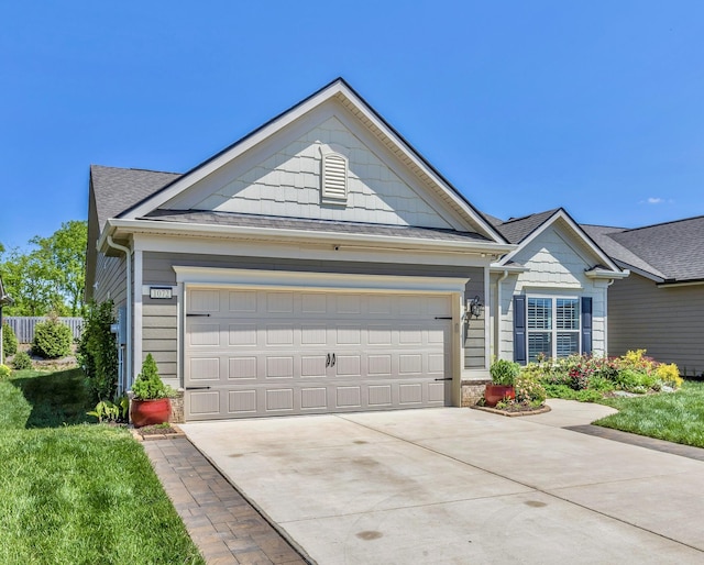 1072 Sumner Grv, Spring Hill, TN 37174 - ranch-style home with a shingled roof, an attached garage, stone siding, a front yard, and concrete driveway