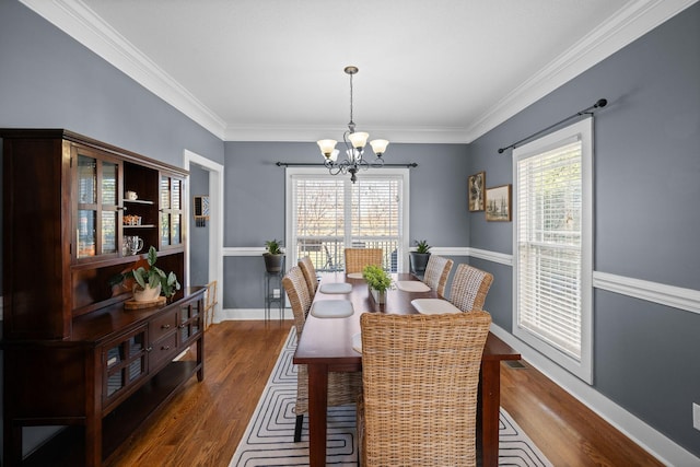 1341 Judge Tyler Dr, Clarksville, TN 37043 - dining area with a healthy amount of sunlight, wood finished floors, and a notable chandelier