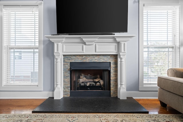 1341 Judge Tyler Dr, Clarksville, TN 37043 - interior details featuring baseboards, wood finished floors, and a fireplace with raised hearth