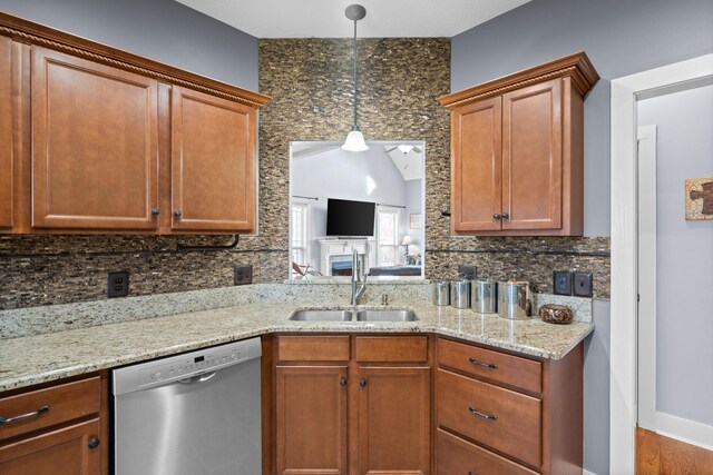 1341 Judge Tyler Dr, Clarksville, TN 37043 - kitchen featuring stainless steel dishwasher, light stone countertops, a sink, and backsplash