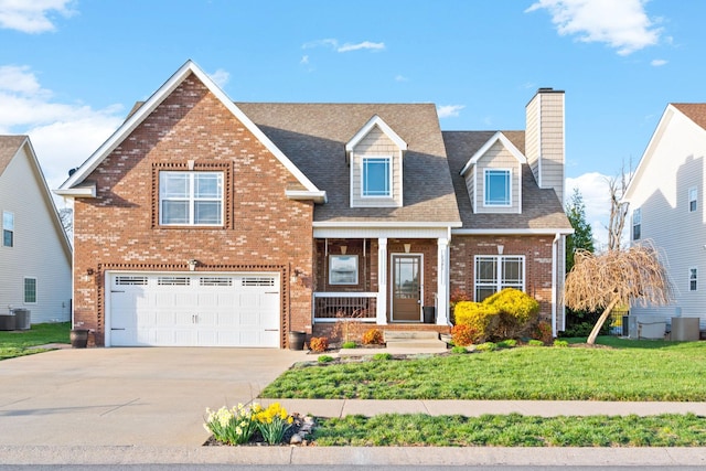 1341 Judge Tyler Dr, Clarksville, TN 37043 - view of front of property featuring central AC unit, brick siding, driveway, a chimney, and an attached garage